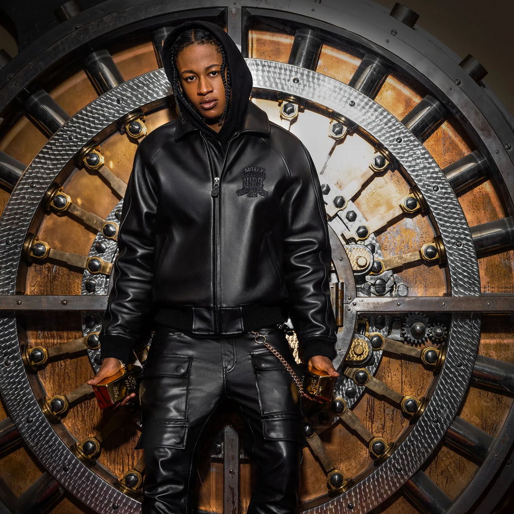 Men’s black Avirex lambskin bomber layered over a hooded sweatshirt with zip front, welt pockets and rib-knit trim