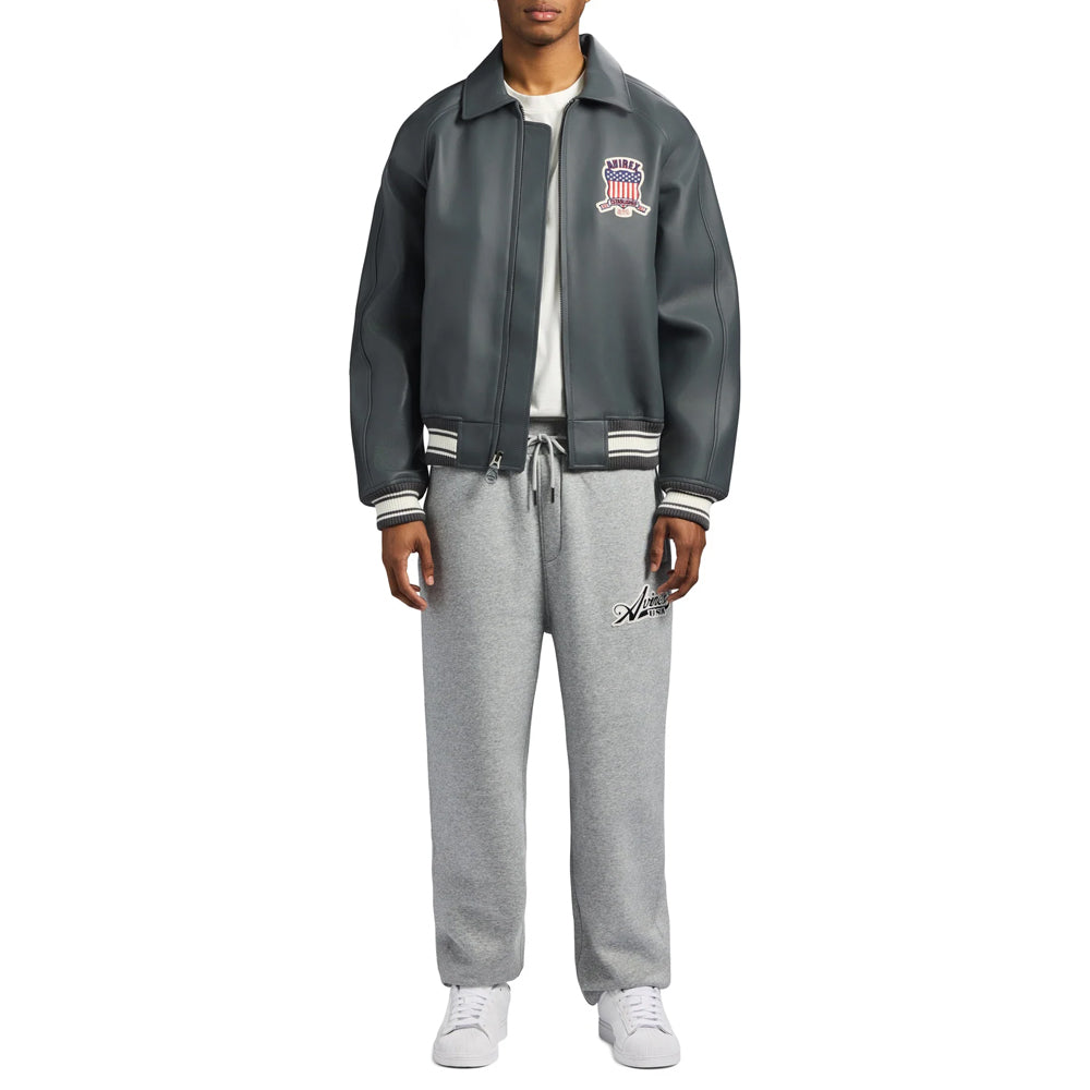 Full-length styling view of men’s Avirex gray Icon leather bomber worn with neutral sweats and white sneakers