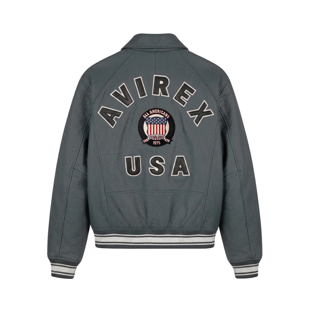 Back view of charcoal Avirex leather jacket showing raised AVIREX USA appliqué and red white blue embroidered shield