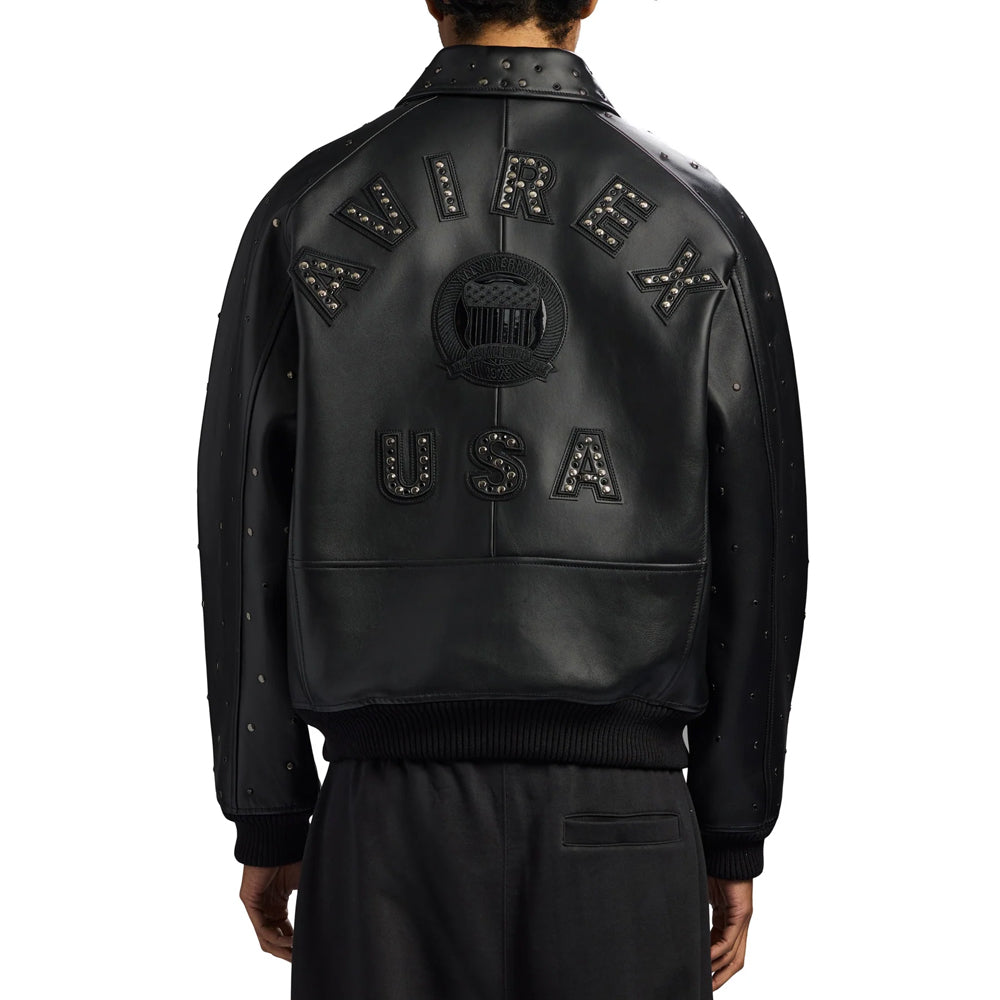 Rear model view of men’s Avirex Iconic jacket featuring gunmetal-studded lettering and smooth black leather panels