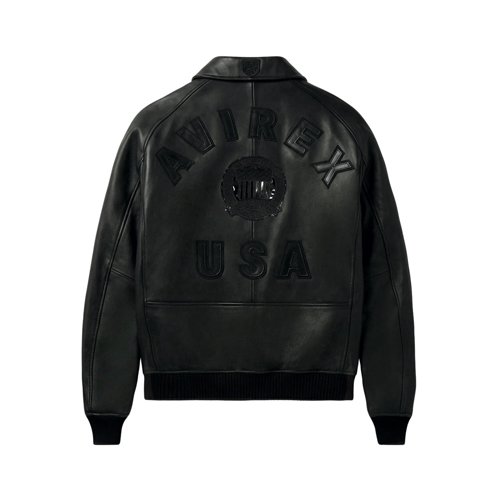 Back view of black Avirex Iconic leather jacket with raised AVIREX USA appliqué, circular crest and ribbed waistband