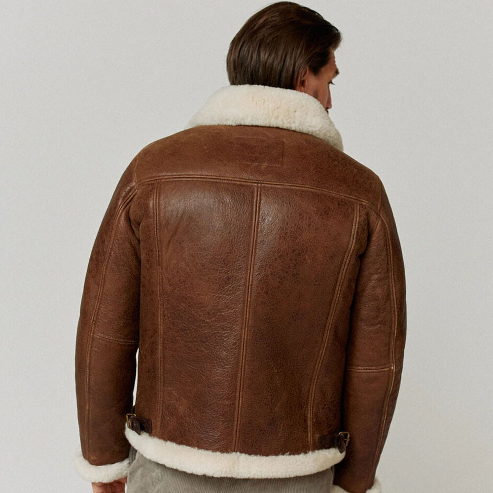 Rear view of model wearing men's B3 RAF aviator jacket showing central spine seam and white fur hem