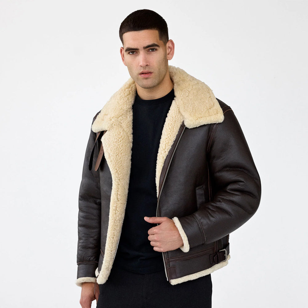 Men wearing dark brown B-3 sheepskin flight jacket open to show the cream shearling lining