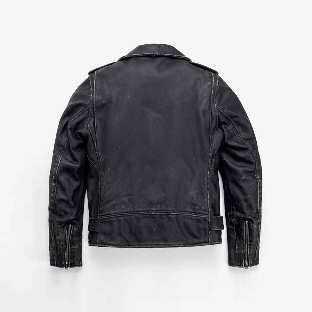 Back view of men’s belted cowhide moto jacket showing broad center panel, vertical side seams and zippered cuffs