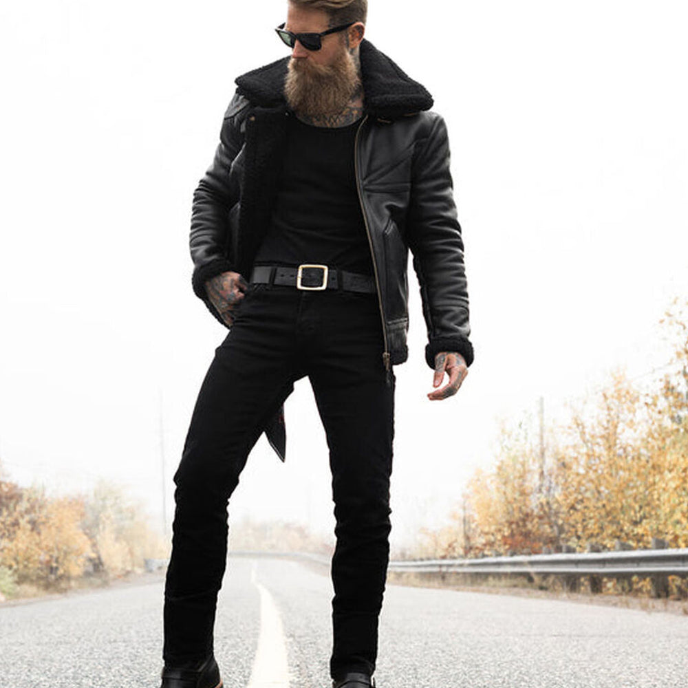 Full body outdoor view of model wearing black B3 leather bomber jacket with black jeans on open road