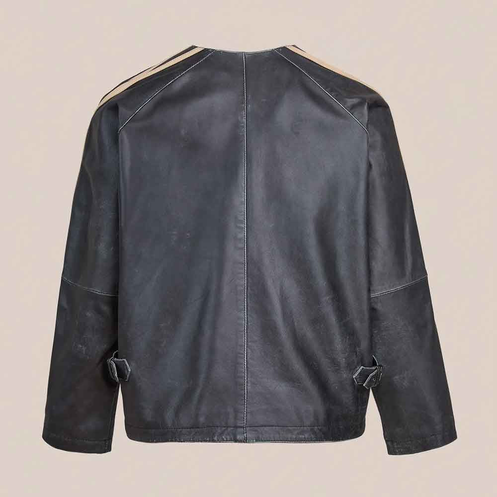 Back view of men’s black leather racer jacket showing center seam, raglan shoulder panels, cream stripes and rear waist adjusters
