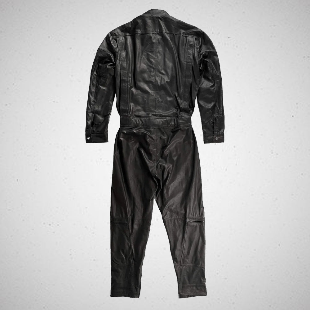 Rear view of men's black leather catsuit showing the full-body fit, back seams and adjustable waist belt