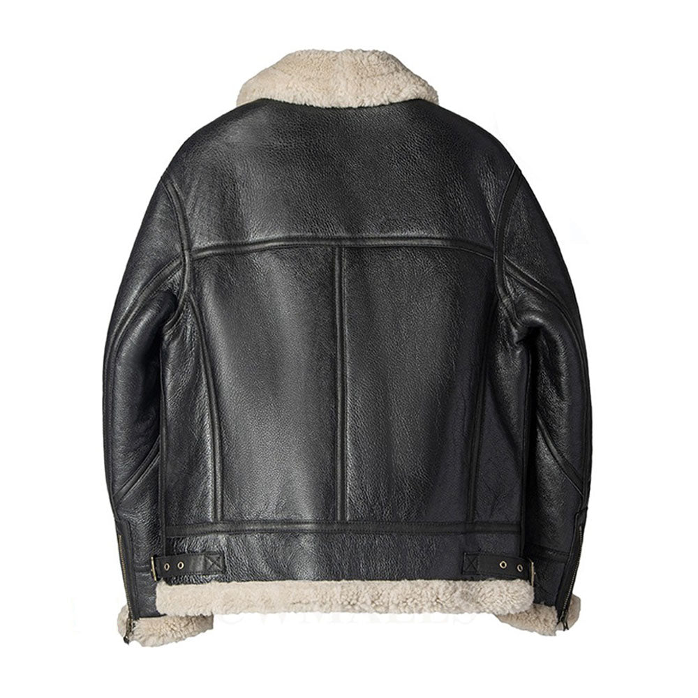 Rear view of men's black sheepskin flight bomber coat showing tonal leather welt piping grid and adjustable waist cinch buckles.