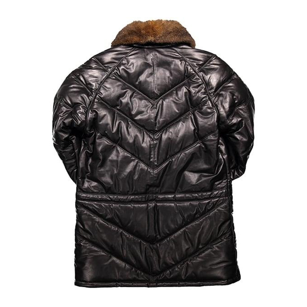 Back view of black leather V-parka showing chevron quilted panels and fur collar