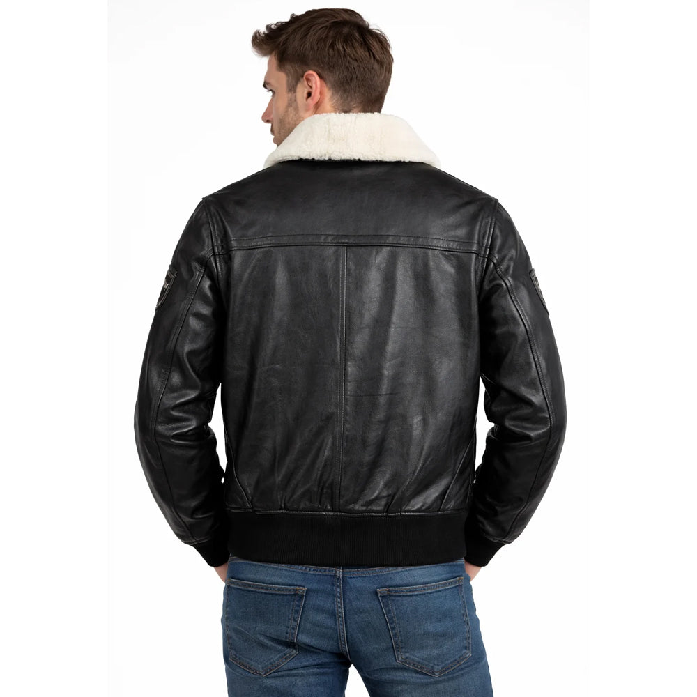 Back view of men's black G-1 pilot leather jacket displaying structured horizontal back yoke seam and ribbed hem