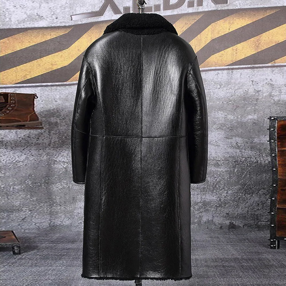Back view of black reversible shearling leather coat on hanger