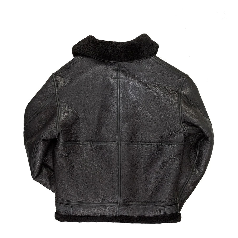 Rear profile of men's black shearling hooded coat showing leather welted seam taping and turned collar.