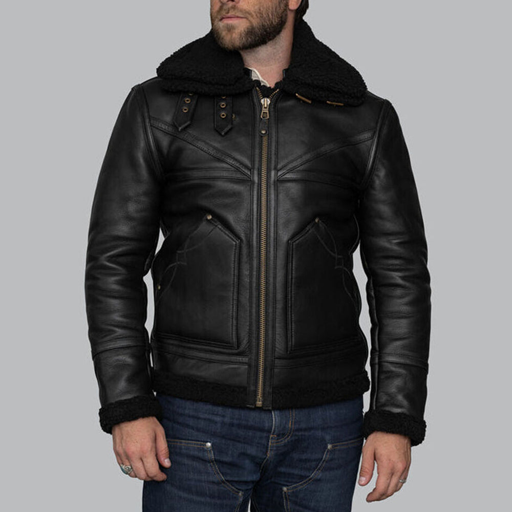 Model wearing fully zipped men's black sheepskin shearling jacket displaying front zip storm flap and collar