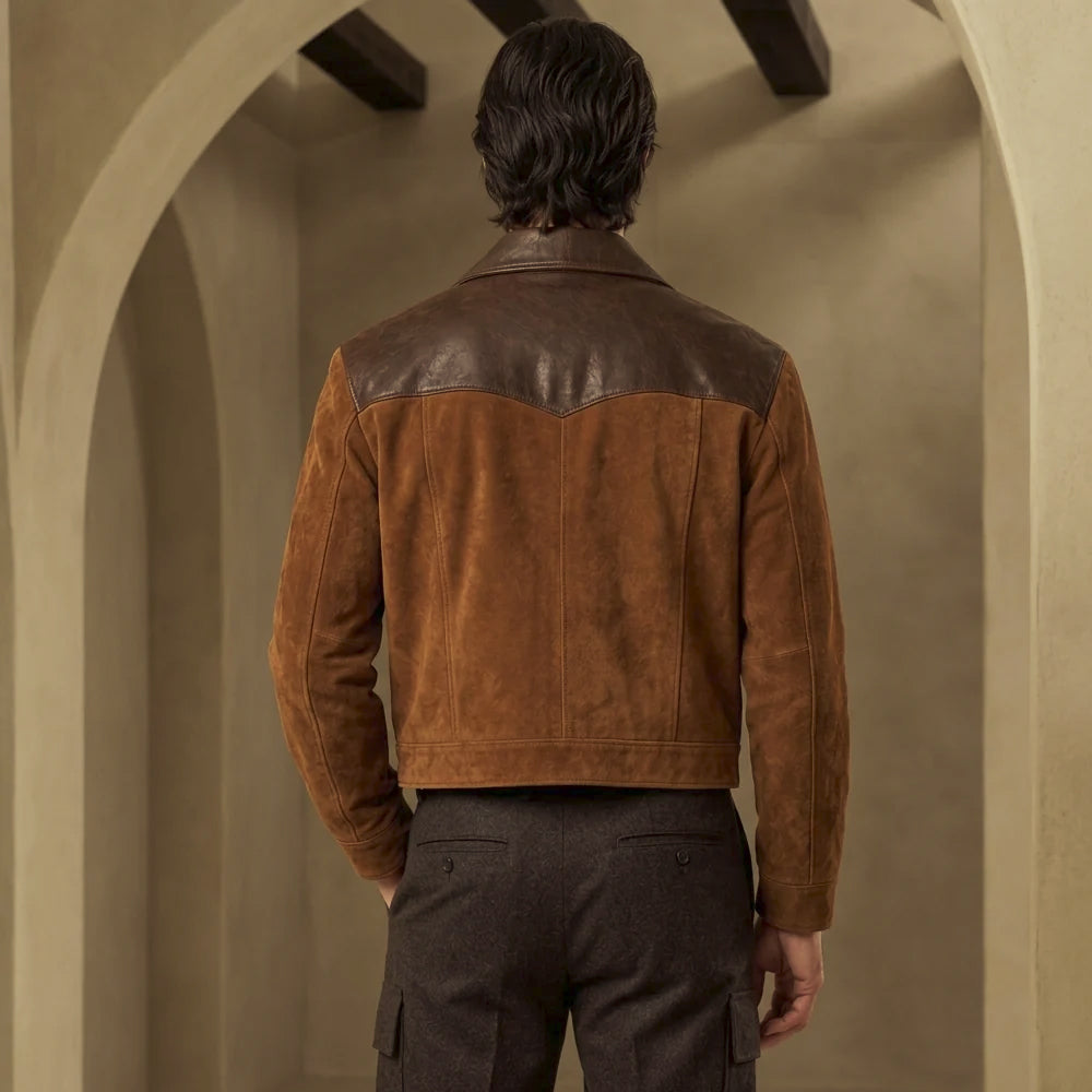 Back view of men’s brown suede jacket showing broad chocolate leather shoulder yoke, center seam and straight waist-length hem.