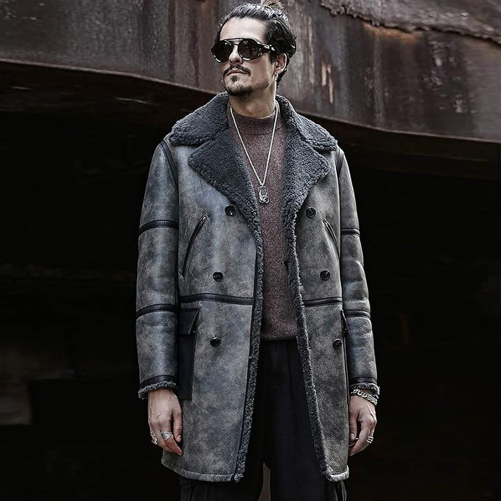 Man wearing distressed grey shearling trench coat with double-breasted buttons