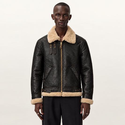 Male model wearing a dark chocolate B-3 aviator jacket with cream shearling collar, exposed cuffs, welt pockets and regular fit.