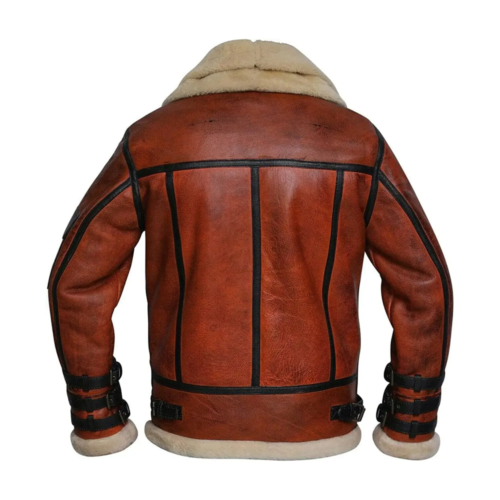 Rear view of men's cognac shearling aviator jacket showing black leather grid seam piping and waist adjustment straps.