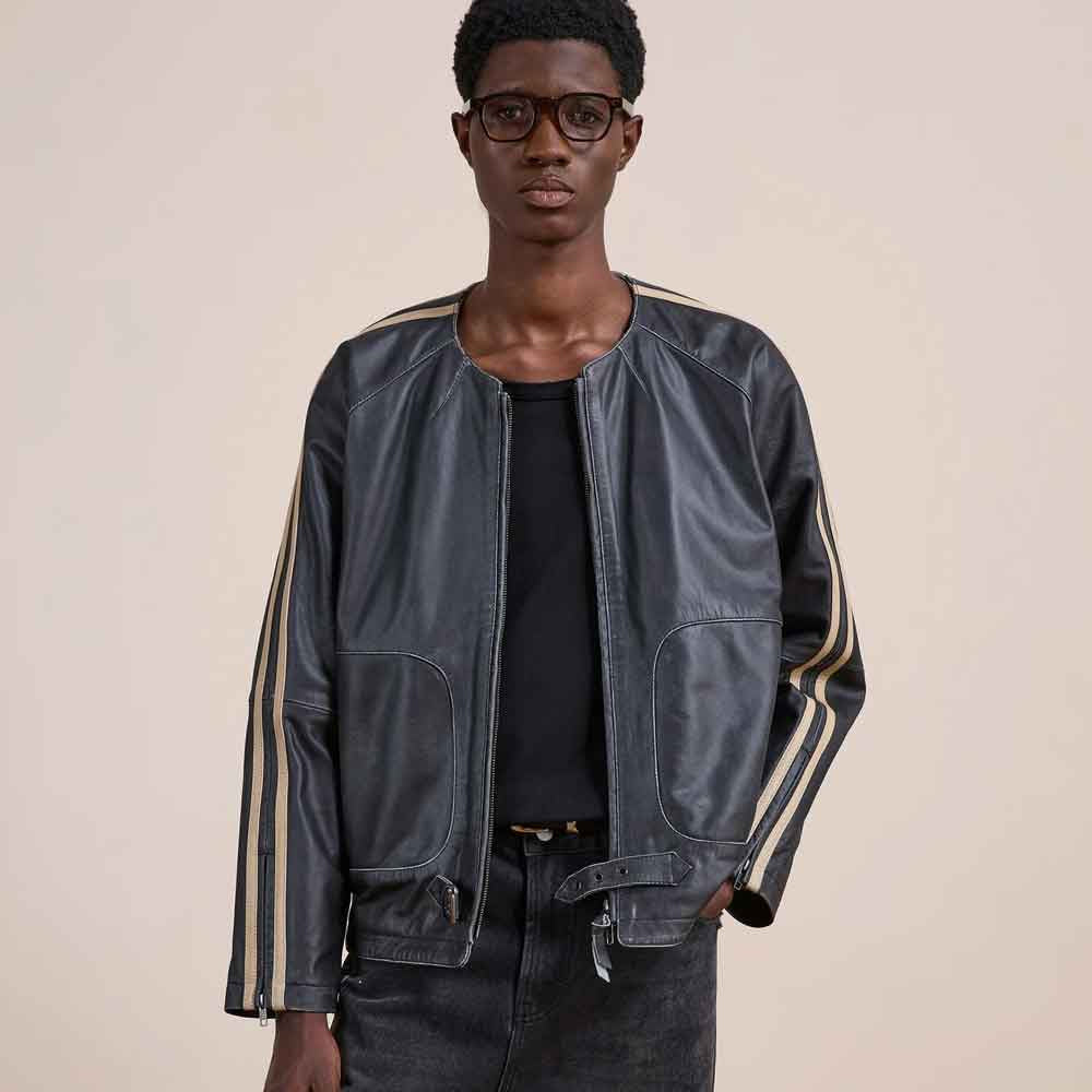 Front model view of men’s collarless cowhide racer jacket with relaxed profile, rounded pockets and adjustable lower-waist hardware