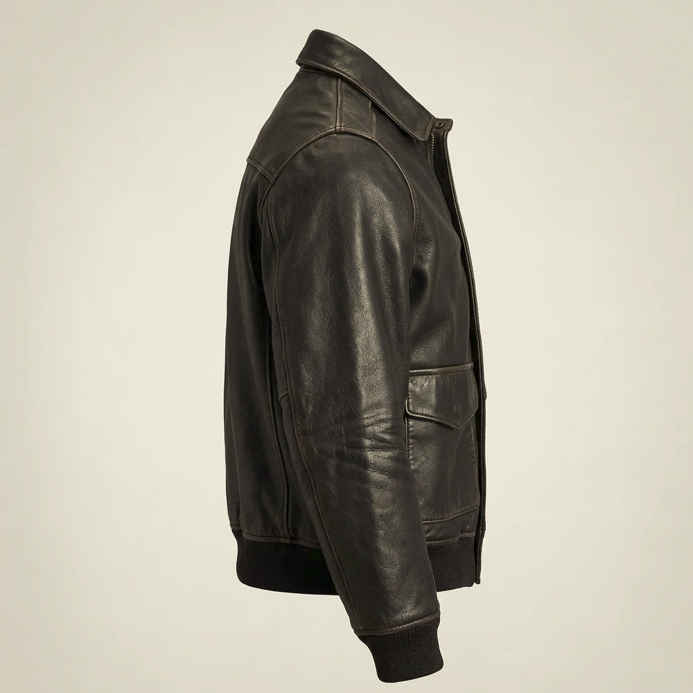 Side profile of men’s concealed-zip leather bomber showing set-in shoulder, curved sleeve panels and waist-length hem