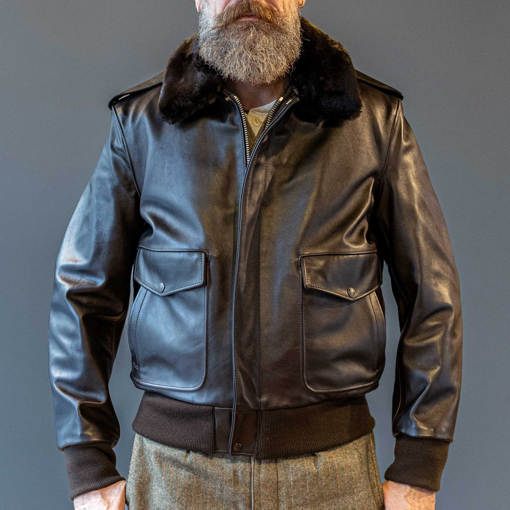 Close-up front view of men's convertible dark brown aviator leather jacket with dark brown shearling fur collar.