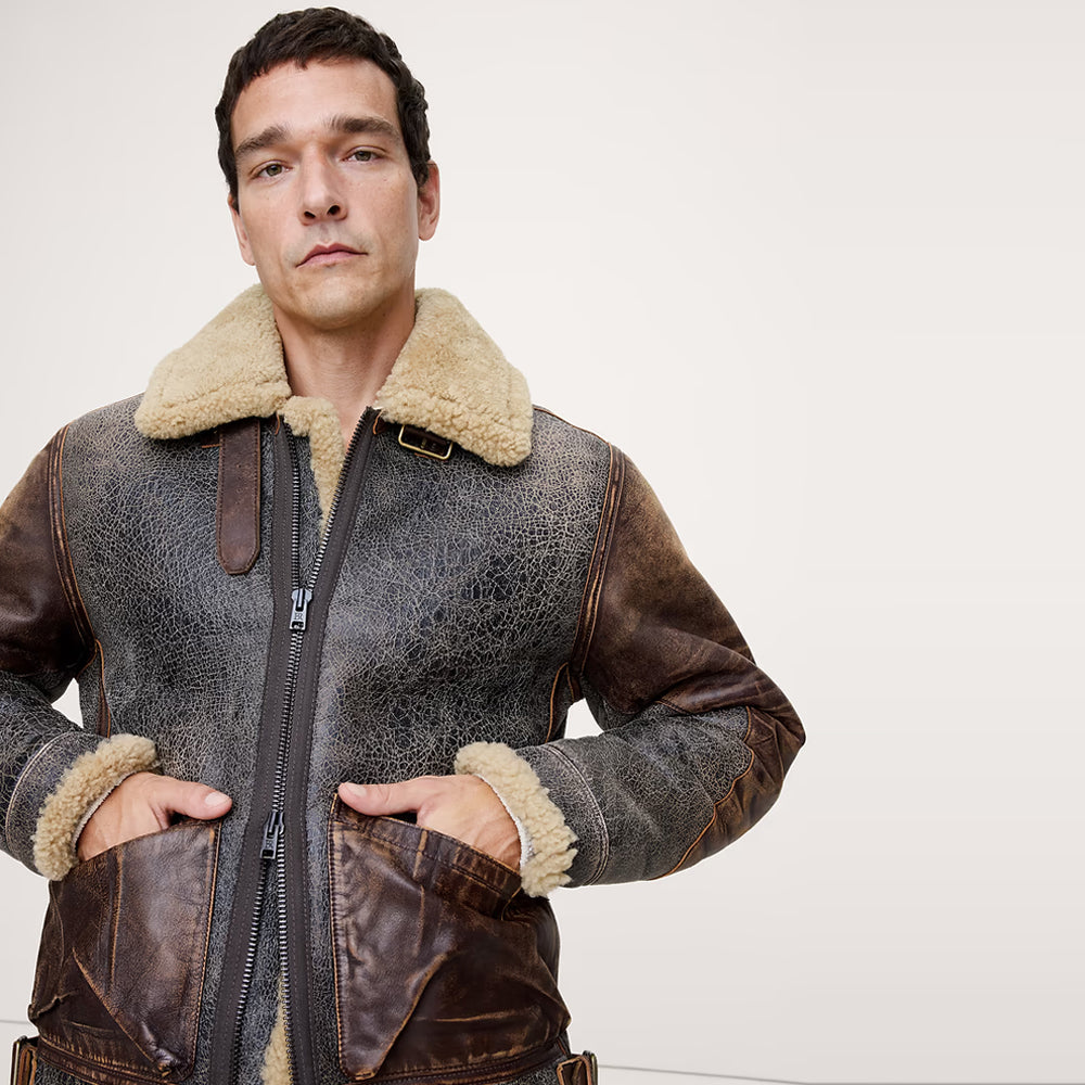 Front view of men's crackled brown B-3 aviator jacket with cream shearling collar and cognac patch pockets