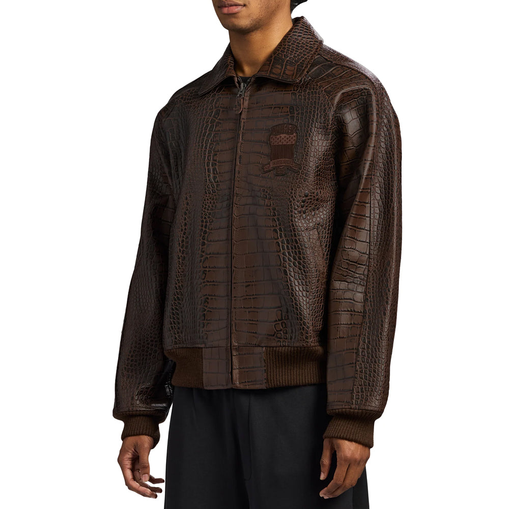 Angled view of men’s lamb leather bomber showing mixed crocodile-scale embossing across chest and sleeve