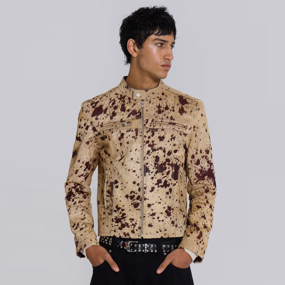 Model wearing a men’s dappled cowhide cafe racer jacket with snap collar and YKK zippers