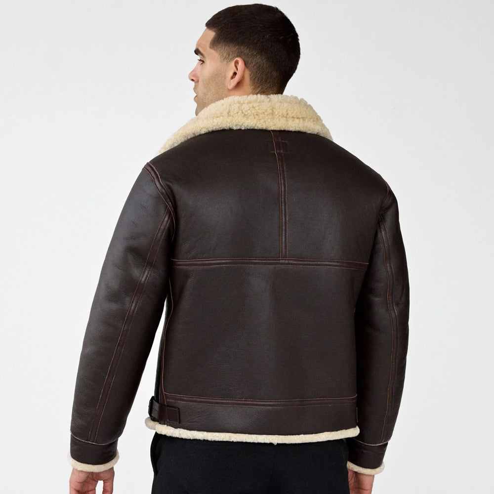 Back view of men's dark brown sheepskin aviator jacket showing reinforced panel seams