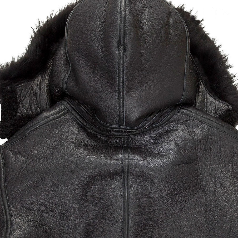 Close-up view of the rear collar zip-off hood attachment mechanism on men's black sheepskin aviator jacket.