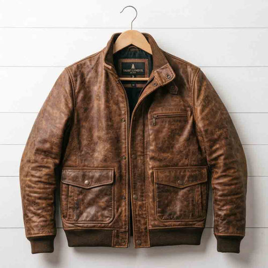 Front view of men's distressed brown bomber leather jacket featuring flap pockets and chest zipper pocket