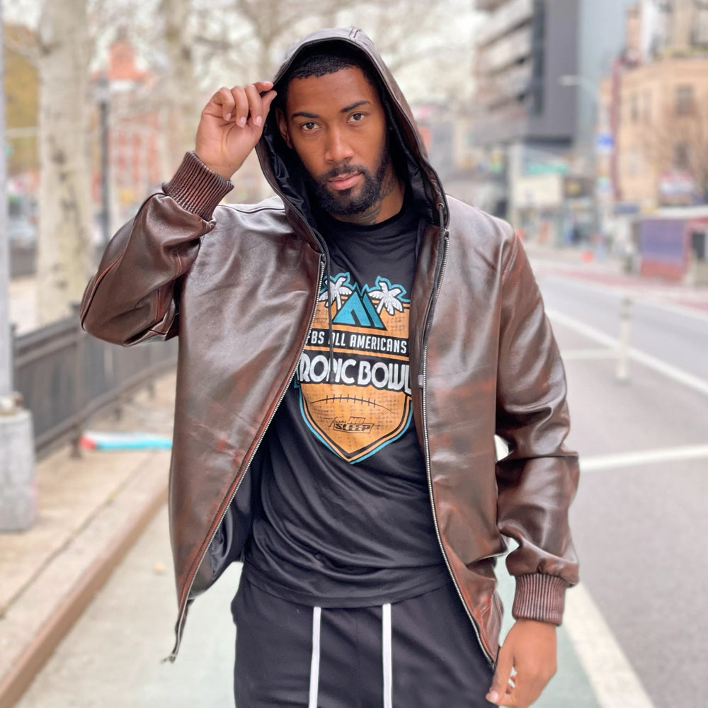Front view of men’s distressed brown leather hoodie with hood raised, copper rub-off highlights, silver full zipper and brown ribbed cuffs.