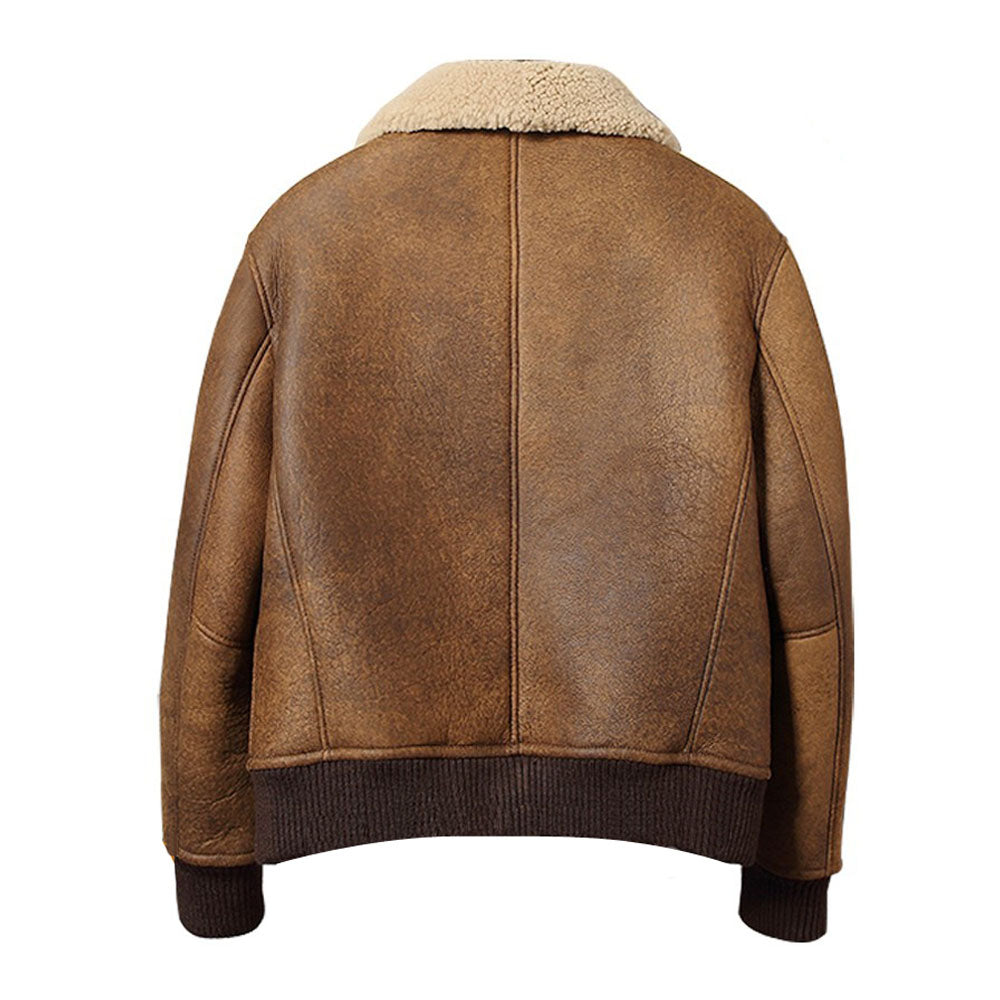 Rear profile of men's camel tan distressed leather bomber jacket showing vertical center spine stitching and ribbed wool cuffs.
