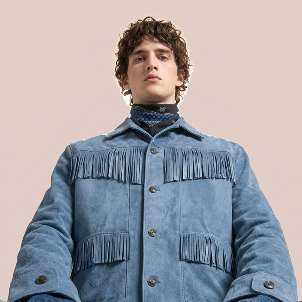 Low-angle view of men’s frontier suede jacket showing chest fringe and adjustable cuffs