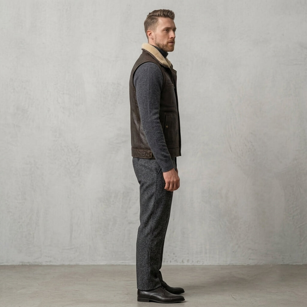 Side profile view of a model in a brown fur-lined leather waistcoat showing adjustable side waist straps.