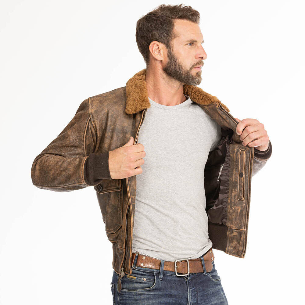 Model opening men's G-1 goatskin leather jacket to demonstrate internal snap chest pocket and satin lining.