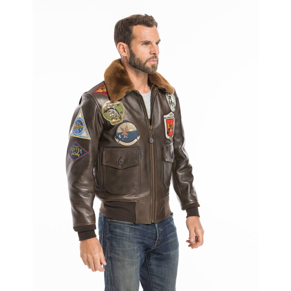 Model standing in men's G-1 naval pilot leather jacket showing action-back shoulder gussets.
