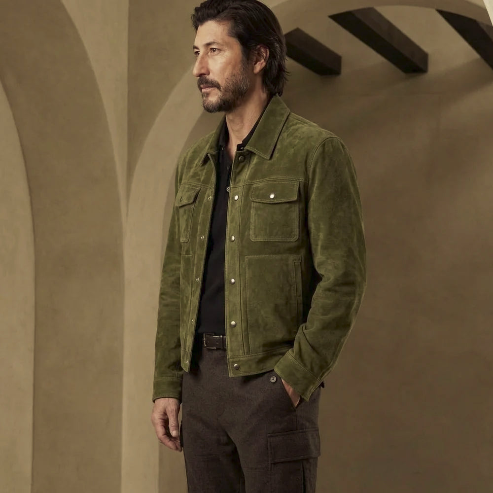 Angled front view of men’s green four-pocket suede jacket with matching topstitching, silver hardware and regular fit.