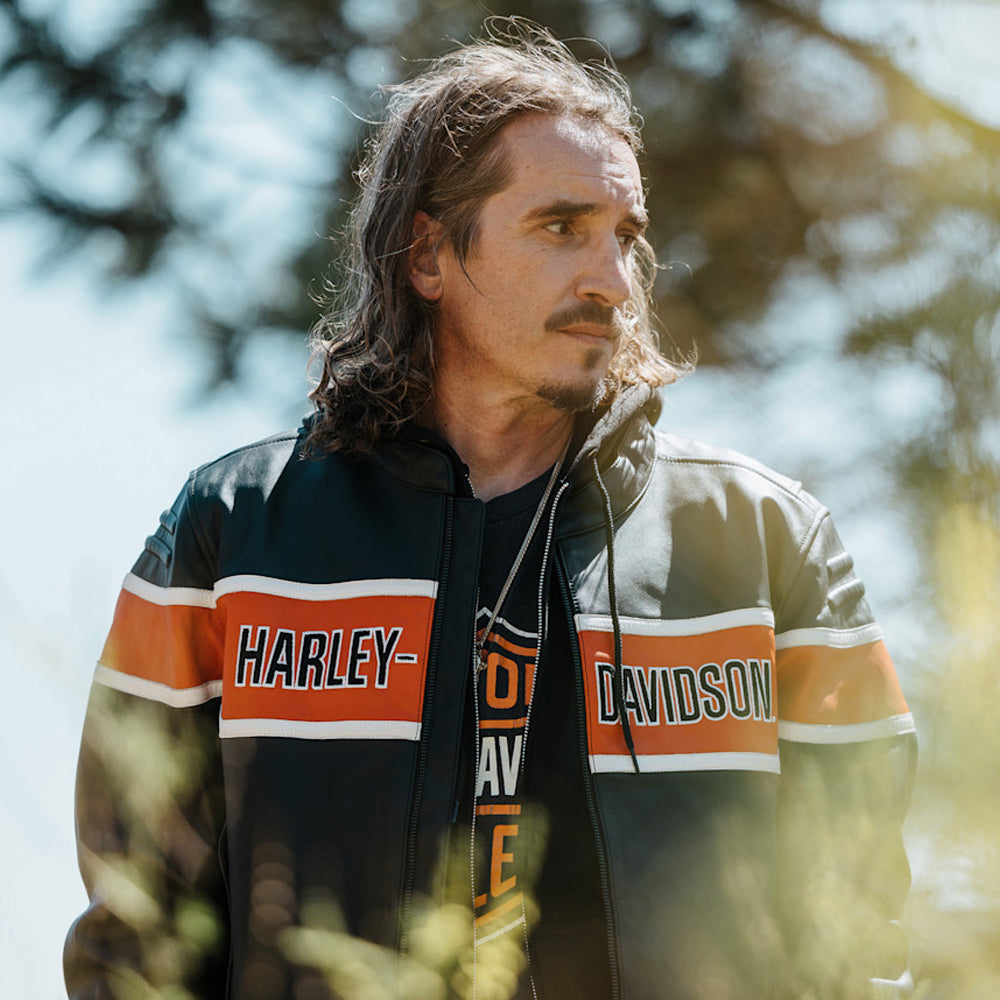 Close-up front view of a men’s Harley-Davidson-style cowhide riding jacket with orange panels and a Mandarin collar