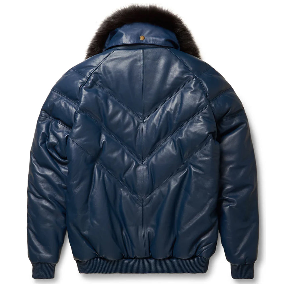 Rear profile view of the navy blue leather V-bomber down coat displaying the distinct quilted chevron pattern.