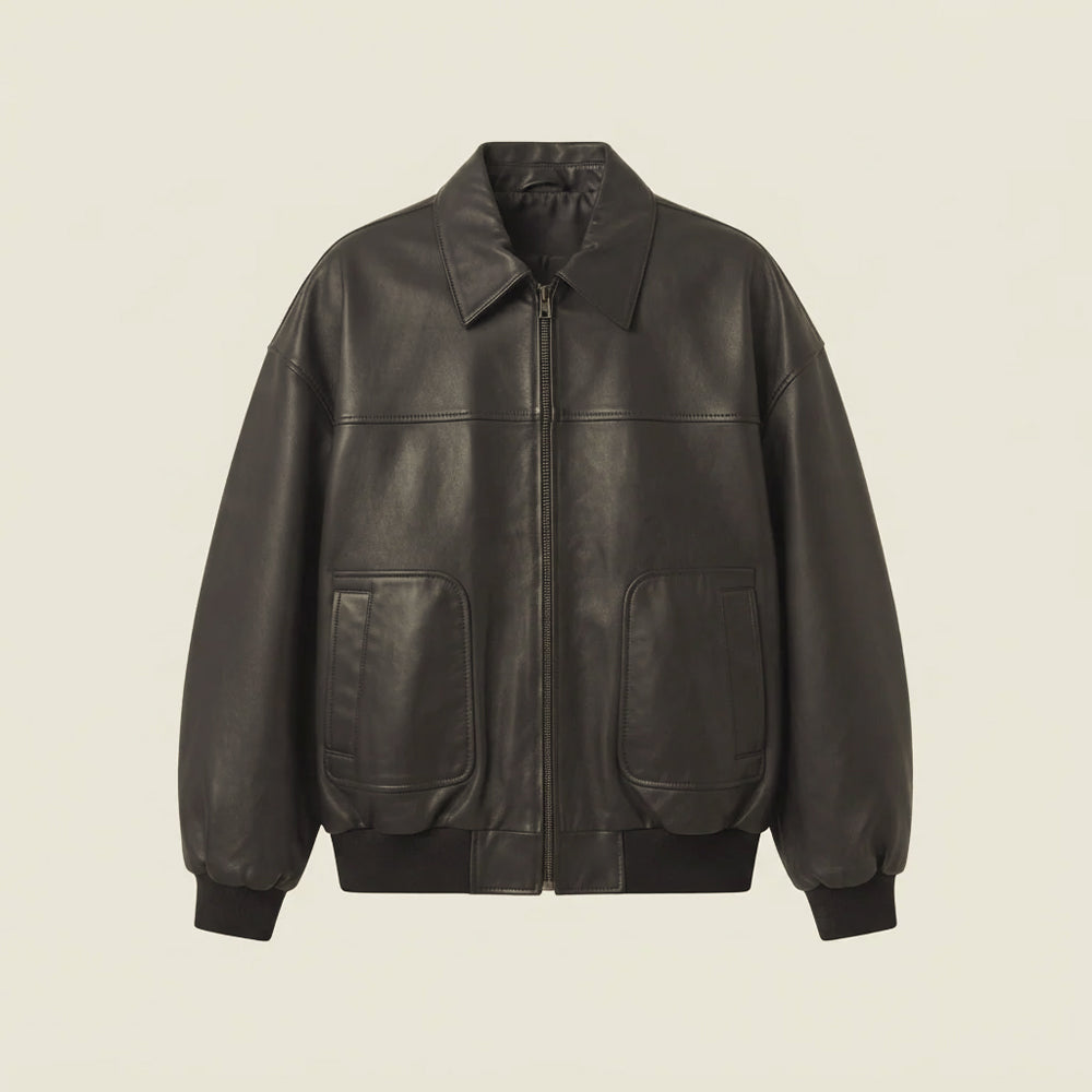 Front flat lay of men’s oversized Oil Black goatskin leather bomber with point collar and vertical-entry patch pockets