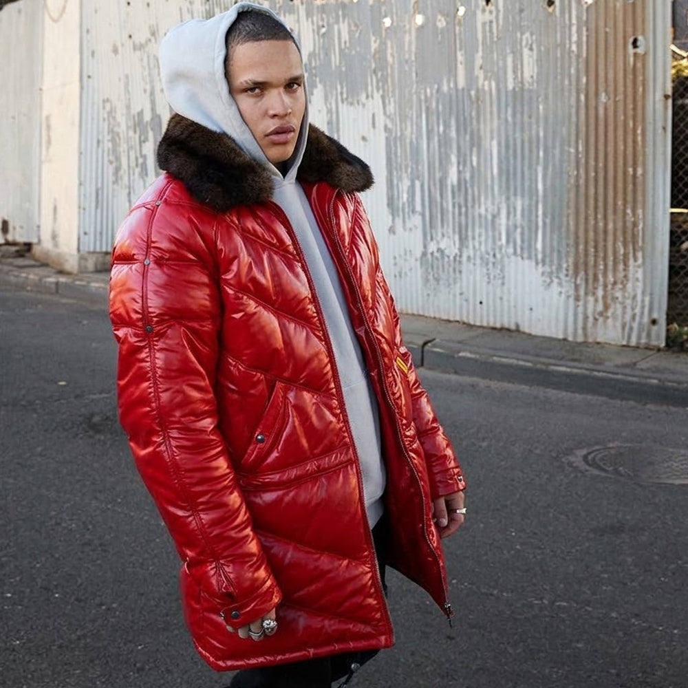 Man wearing red leather V-coat with hood and detachable fur collar on urban street