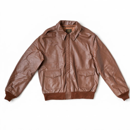 Front flat lay view of men's A-2 russet brown grain cowhide military flight leather bomber jacket showing scalloped flap pockets and storm flap.