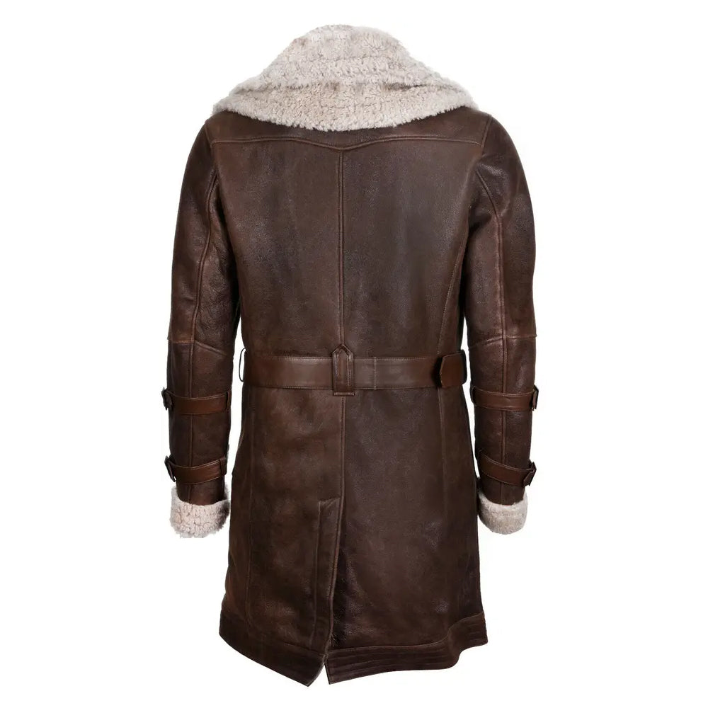 Back view of dark brown shearling trench coat showing belted waist and vent slit