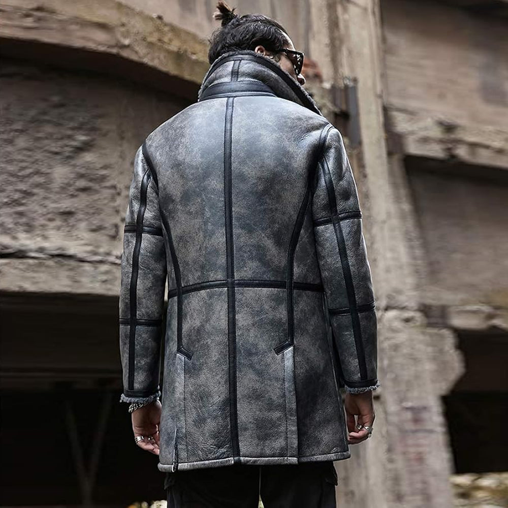 Back view of man wearing grey shearling coat showing contoured panel seams