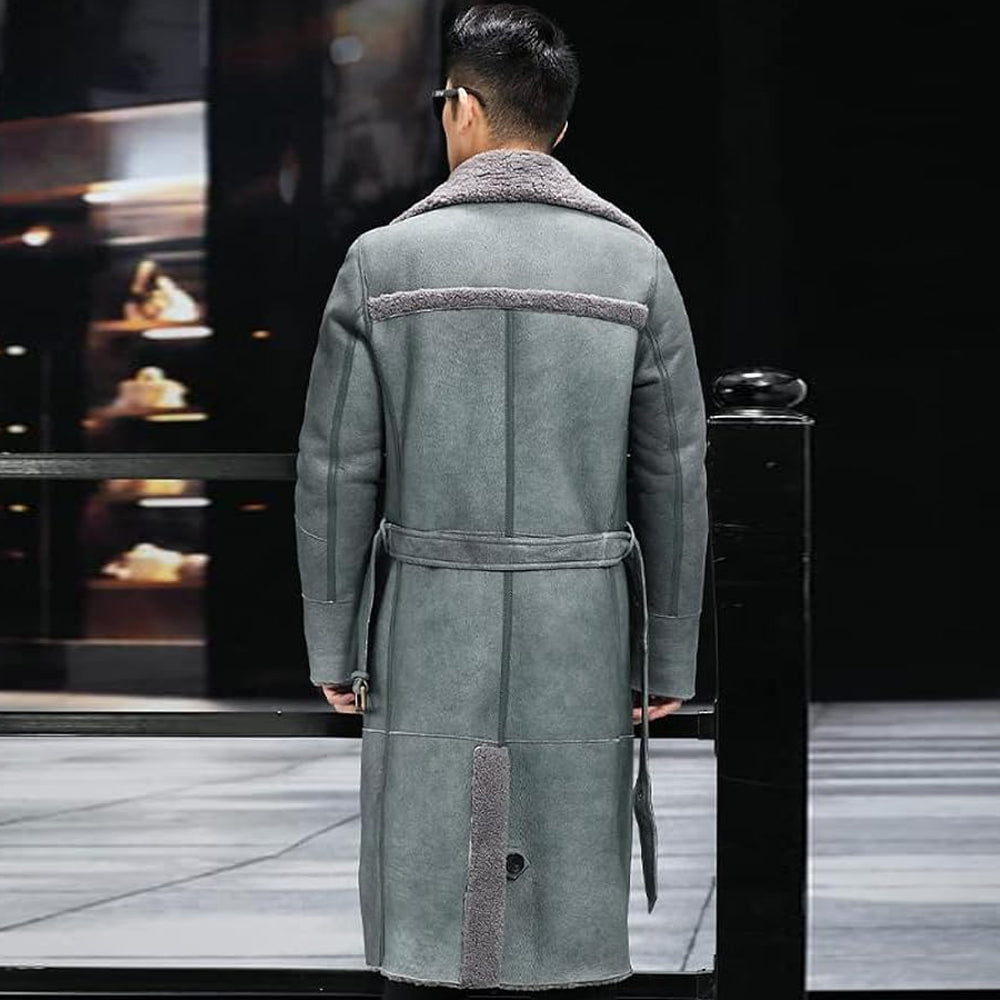 Man wearing slate grey belted shearling greatcoat from behind