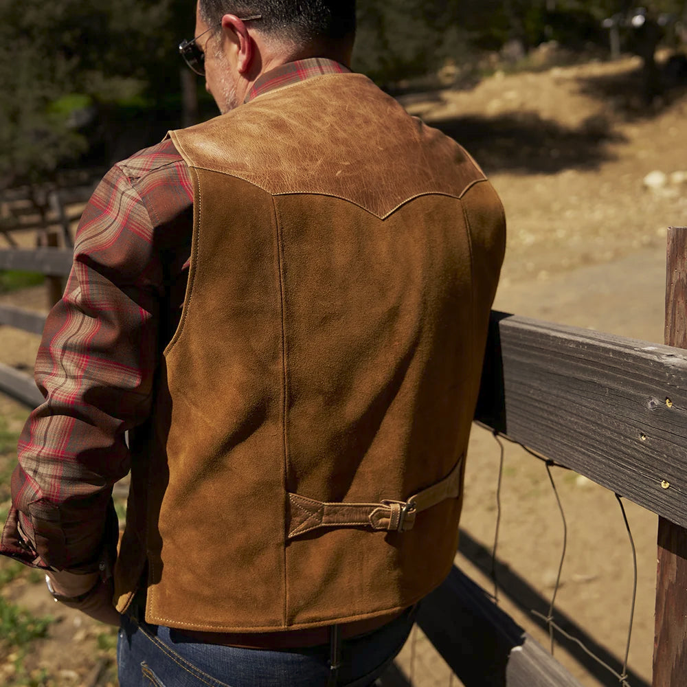 Rear model view of men’s suede vest featuring a pointed Western leather yoke and waist-adjustment strap