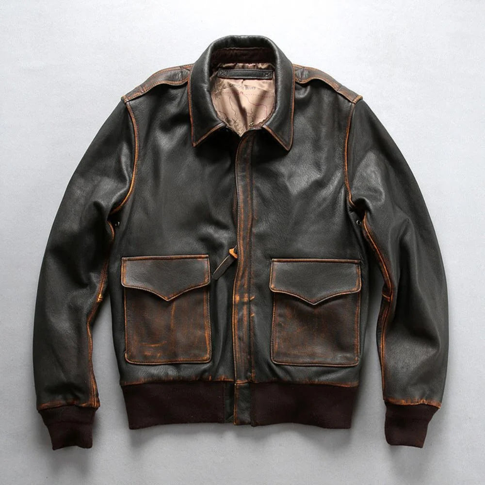 Front flat lay view of men's washed goatskin tea-core A-2 flight jacket with flap pockets and brown rib trim.