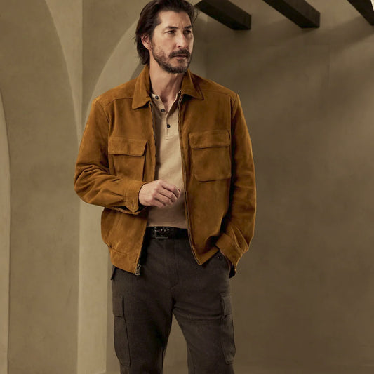 Front view of a men’s tobacco suede utility shirt jacket with point collar, full zipper and four-pocket workwear layout