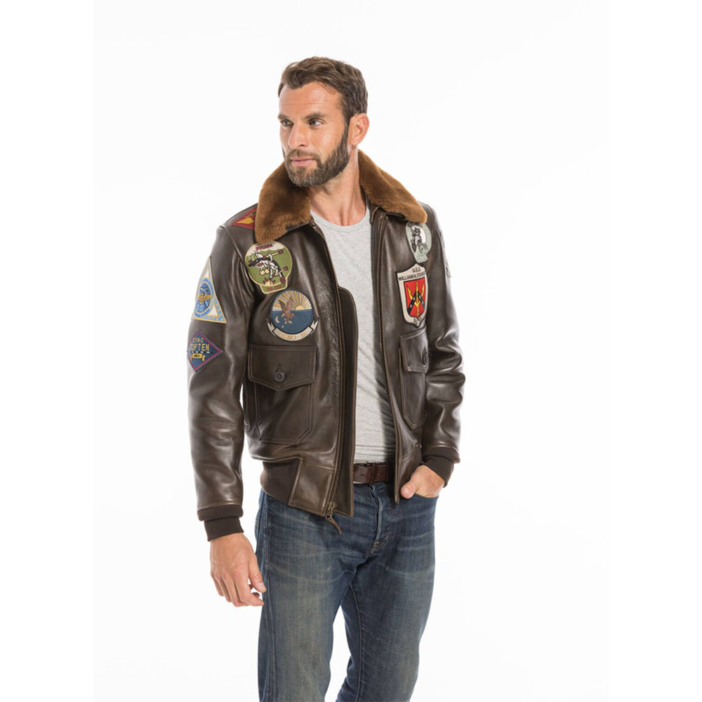 Model in men's Top Gun G-1 aviator jacket showing sleeve badges and snap-off collar.