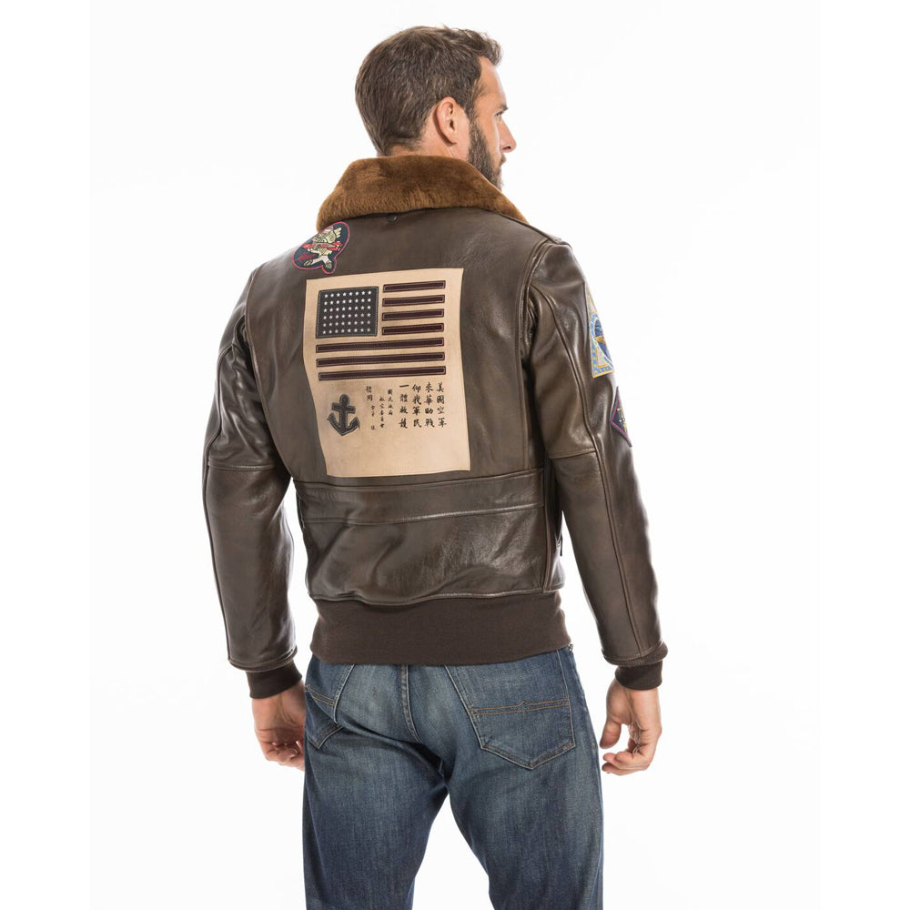 Rear view of model wearing men's Top Gun G-1 flight jacket showing bi-swing action back.